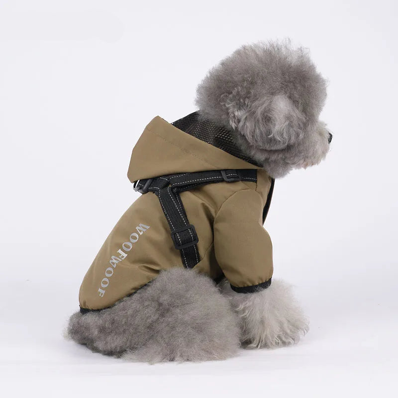 Belinana dog rain coat waterproof in khaki with hood and black harness worn by fluffy gray dog