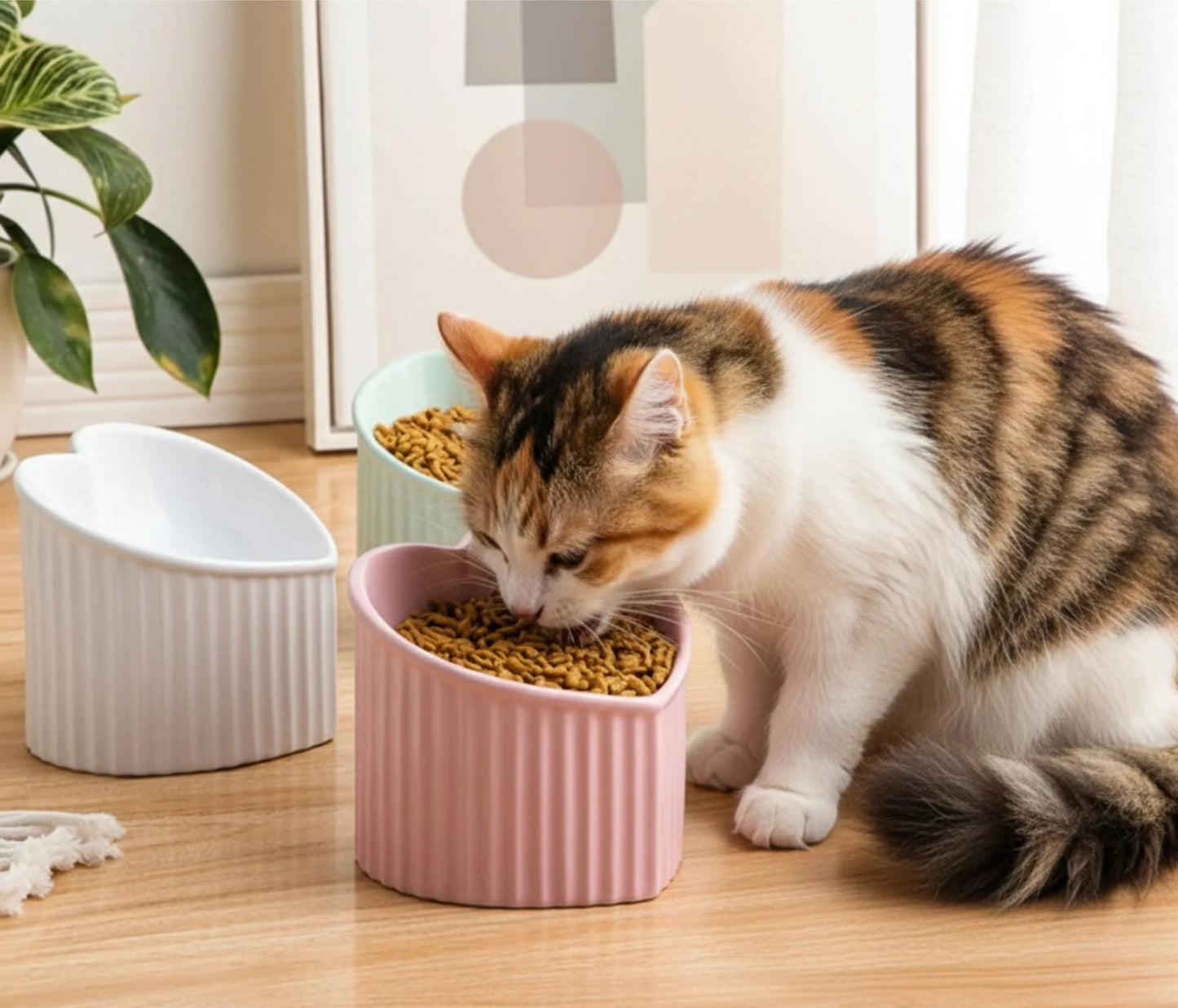 Ceramic pet bowl inclined mouth in pink, white, and green for cats, designed for easy feeding