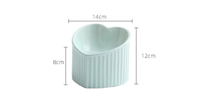 White ceramic pet bowl inclined mouth in heart shape, ideal for cats and small dogs
